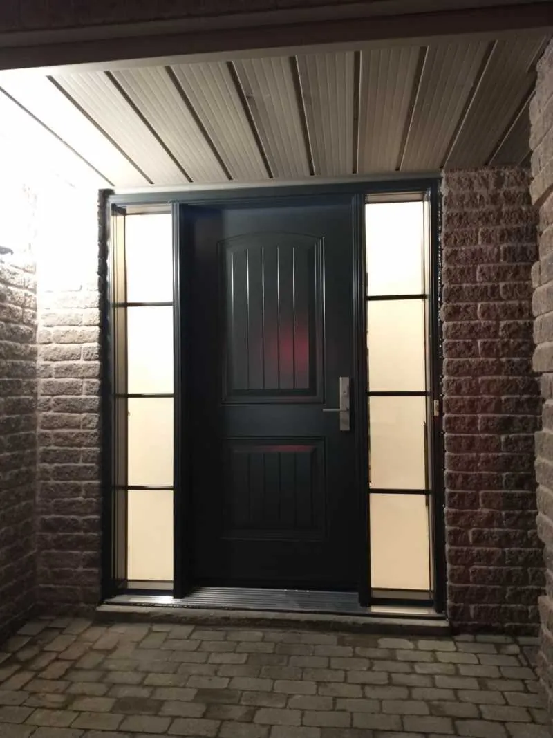 Black entry door with two frosted sidelights