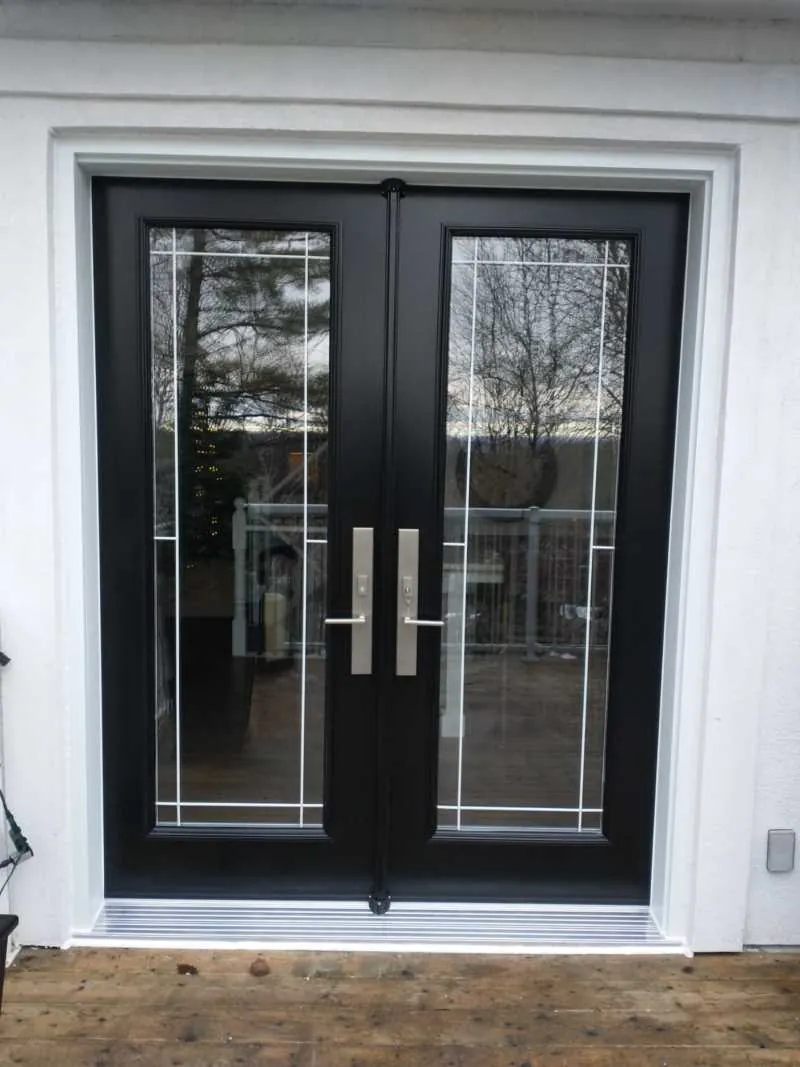 Black double doors with decorative glass