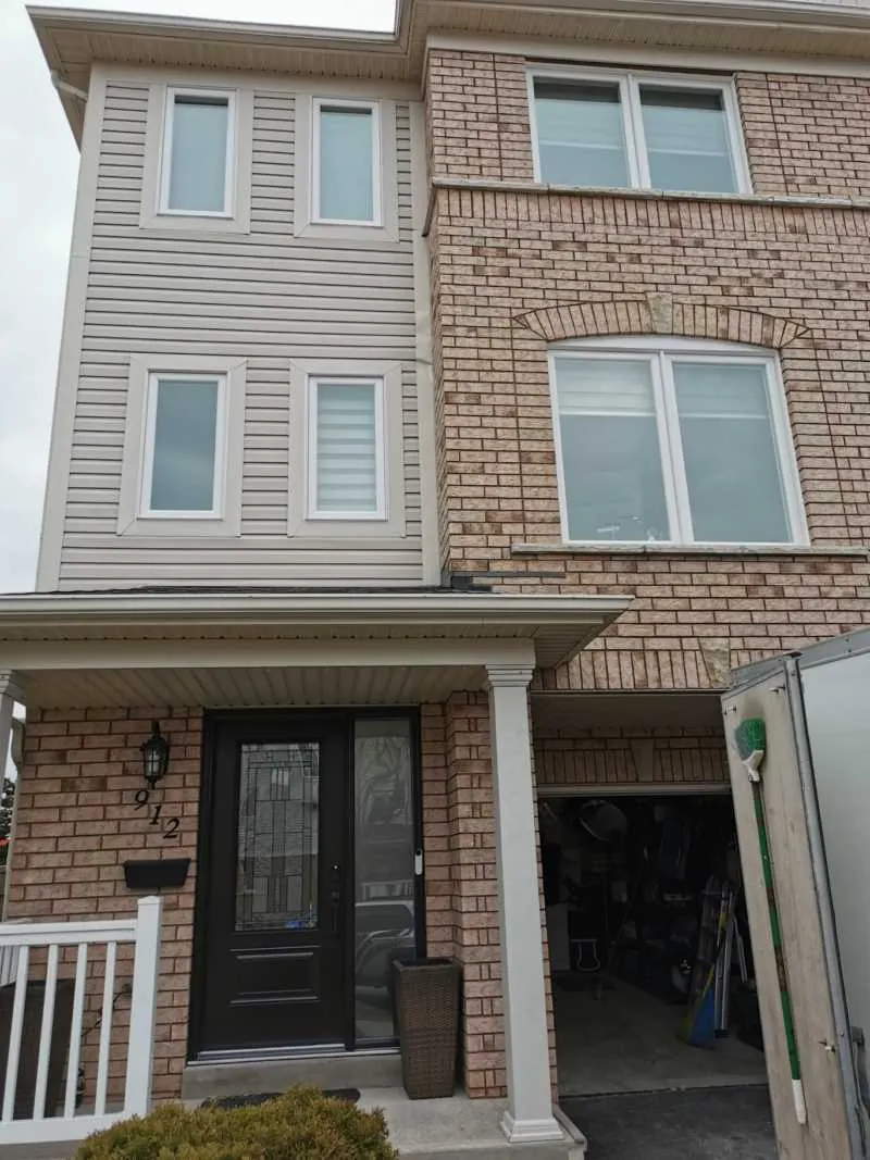 New windows on a brick and siding townhouse