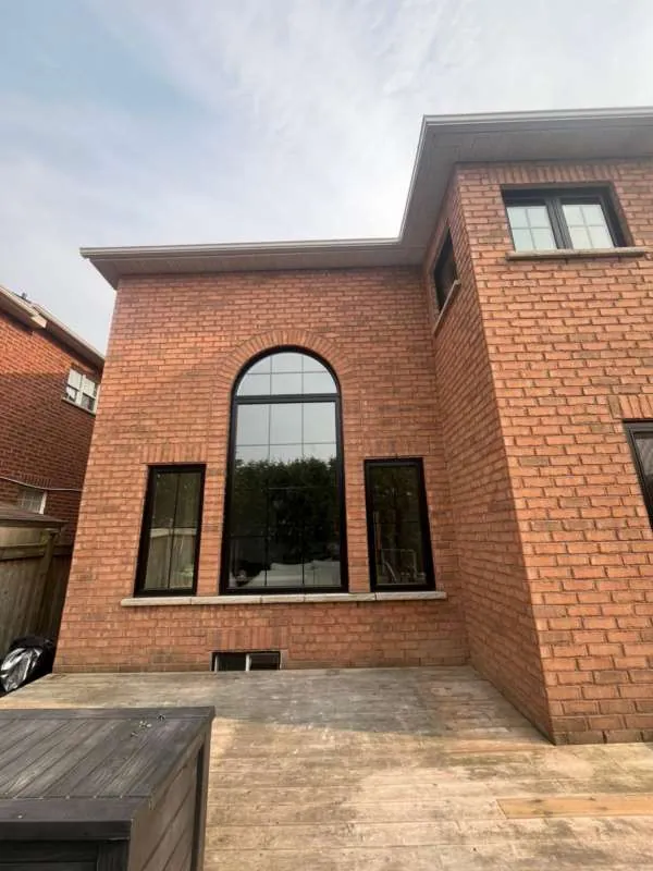 Modern Black Windows Upgrade: after The same Innisfil home with new black-framed windows, after replacement