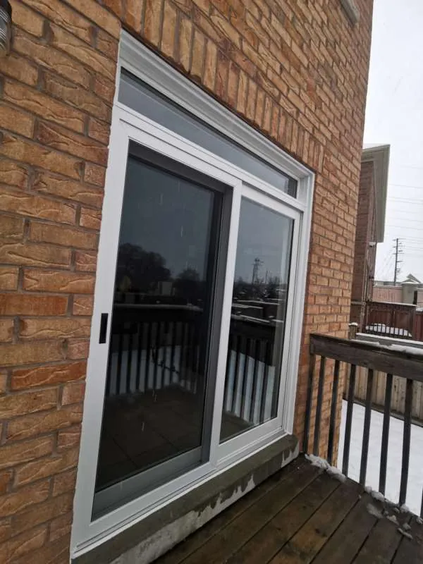 Sliding Patio Door Replacement: after New white sliding patio door onto the same Orillia deck, after replacement