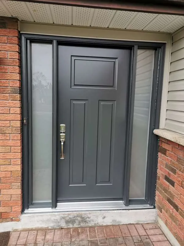 Front Entry Door Upgrade: after New charcoal front door with two sidelights on the same Alliston home, after replacement