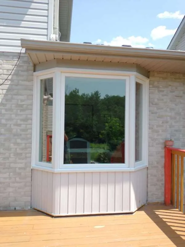 Bay Window Upgrade: after New white bay window on the same Barrie home, after replacement