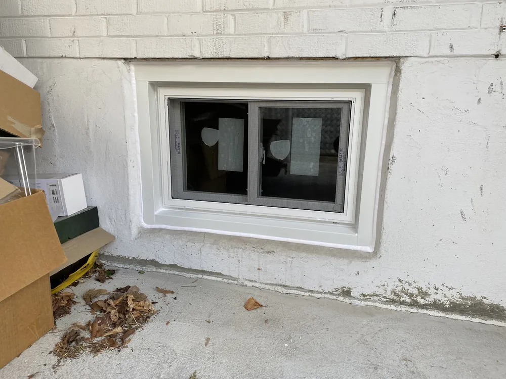 Basement slider window on a painted wall