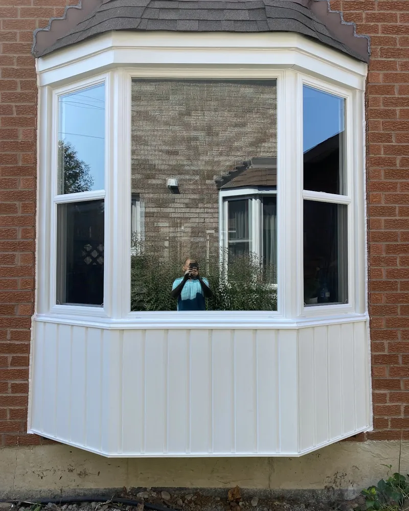 Worn Bay Window Fully Replaced: after Bay window on a brick house after replacement