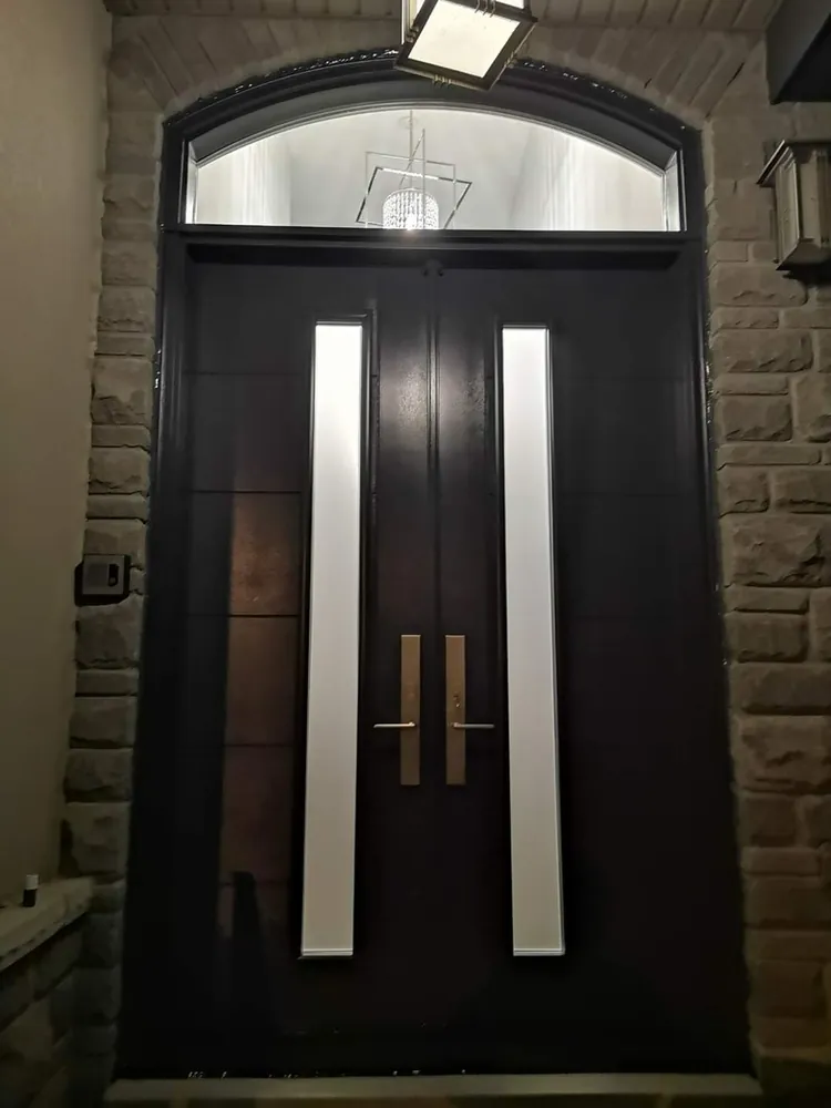 Black double doors with an arched transom in Sudbury