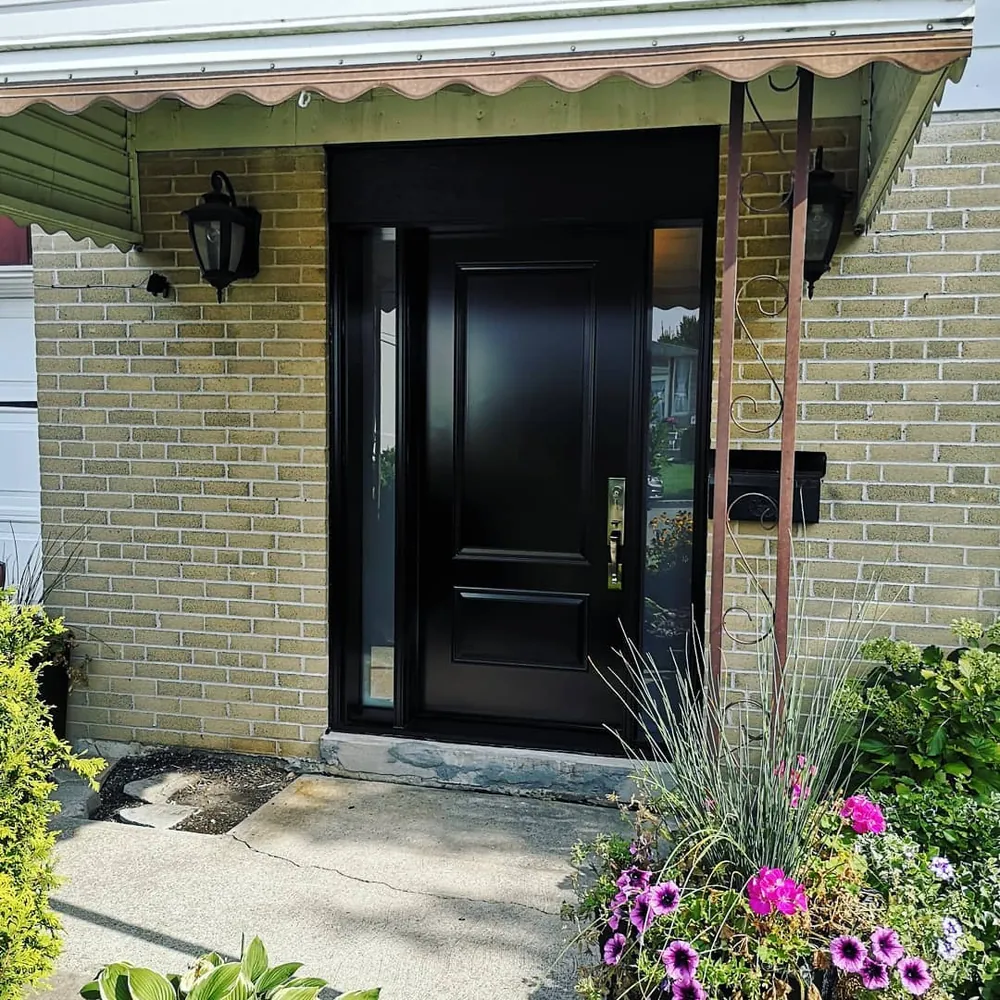 Black front door with a sidelight in Hamilton