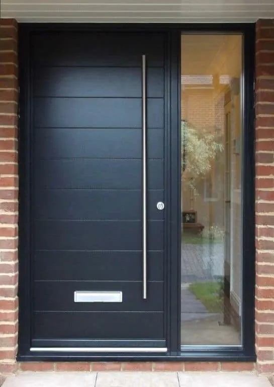 Black modern front door with a sidelight in Oshawa, installed by Panorama Windows & Doors Black modern front door with a sidelight in Oshawa