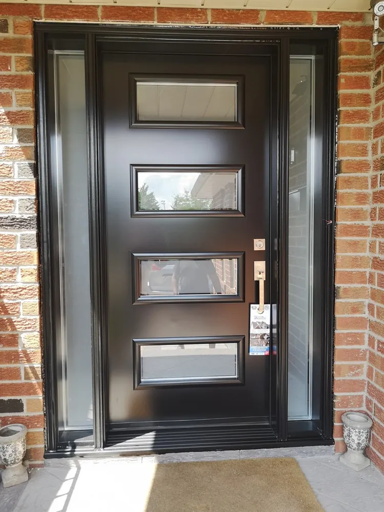 Black modern four-lite front door with sidelights in Innisfil, installed by Panorama Windows & Doors Black modern four-lite front door with sidelights in Innisfil