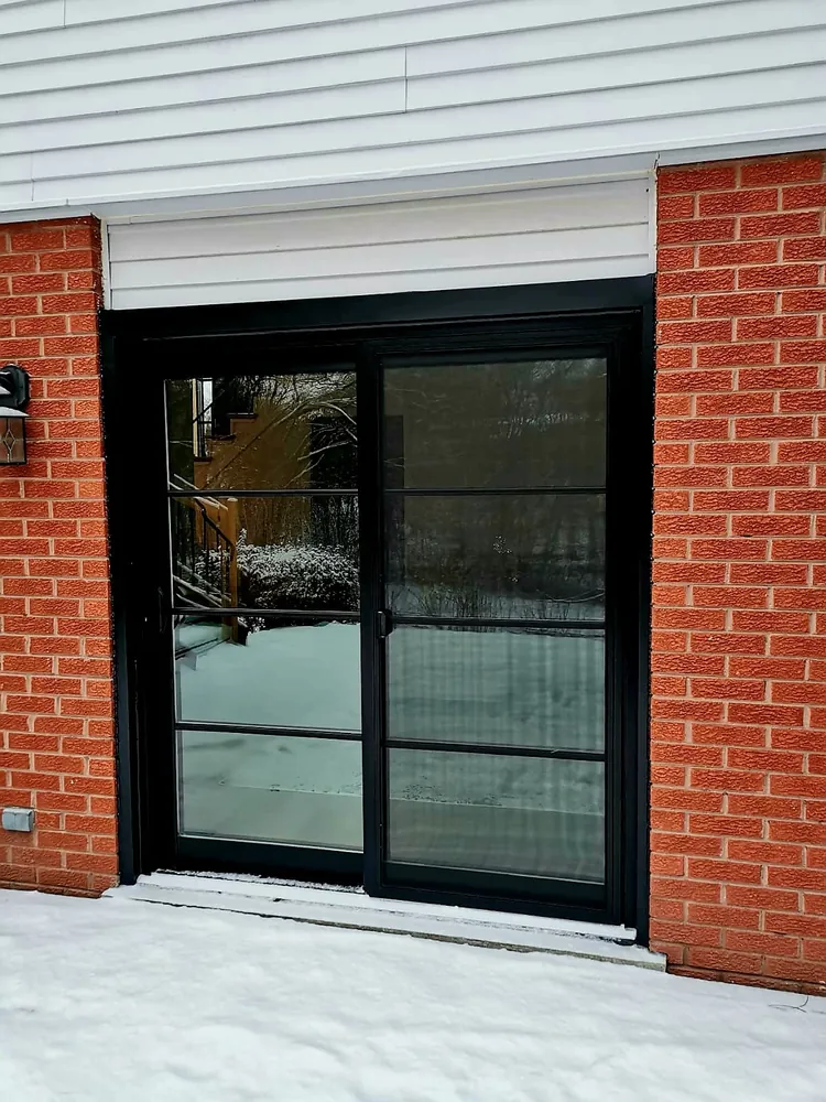 Black sliding patio door with grilles