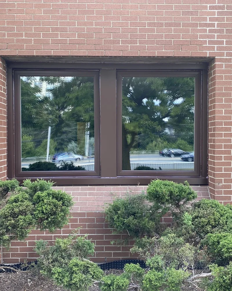 Commercial Windows Without the Wall AC Units: after Two windows on a brick building after replacement in Brampton