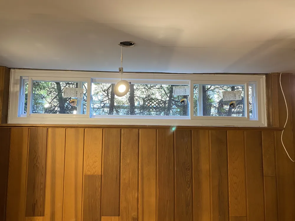 End vent slider window in a basement rec room