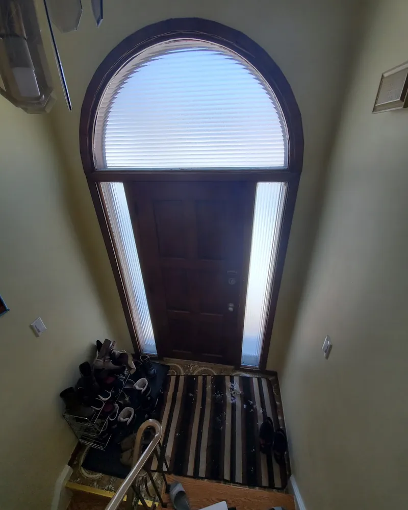Arched Entry Door, Inside View: before Front door under an arched transom before replacement