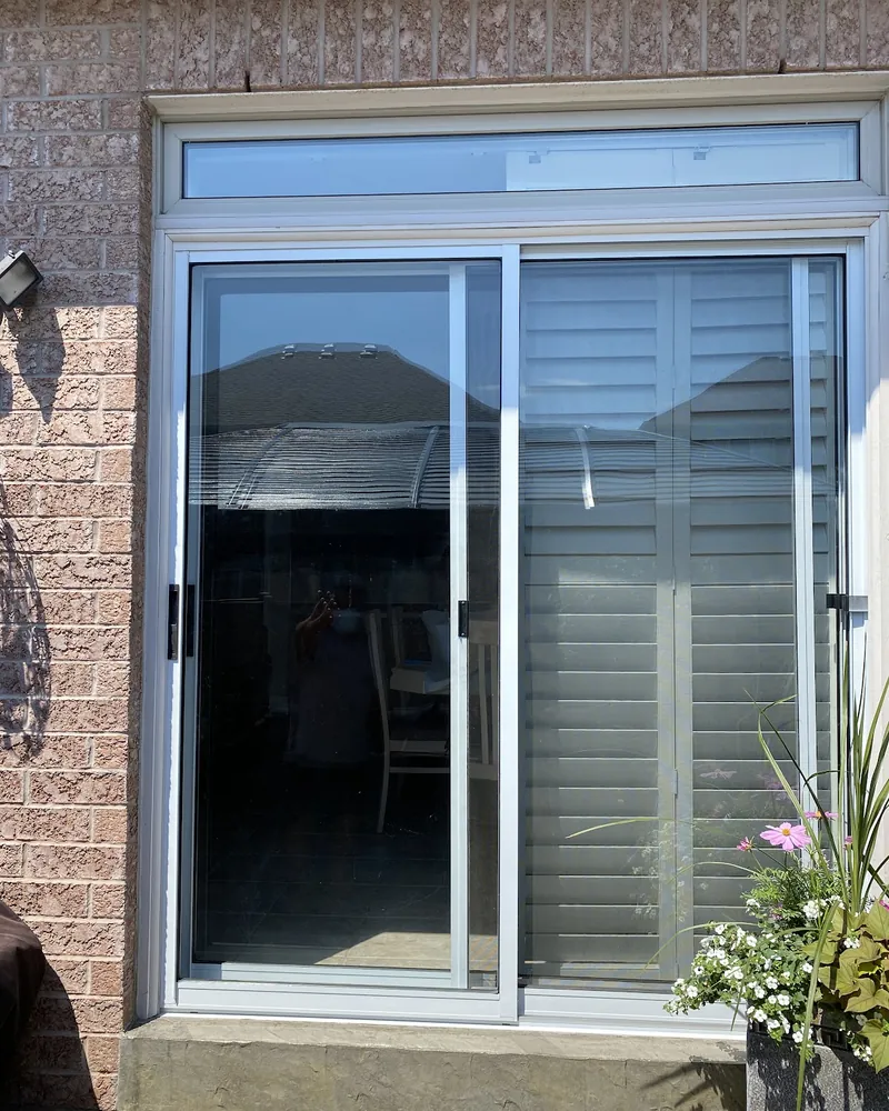 Patio opening with a transom window before replacement in Brampton
