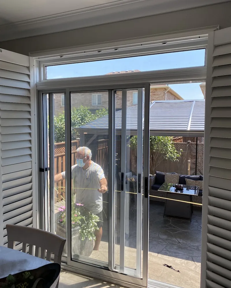 French Doors With Transom, Inside View: before Patio doors seen from the kitchen before replacement in Brampton