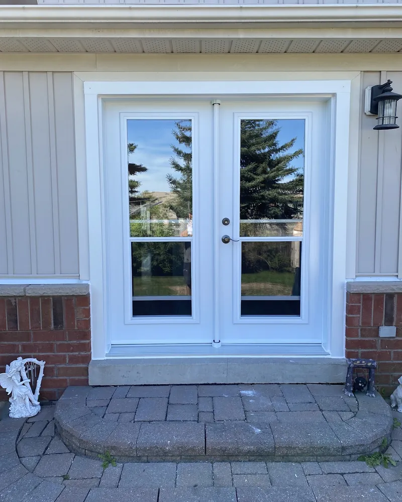 Garden Door to White French Doors: after Patio doors on a siding wall after replacement in Oshawa