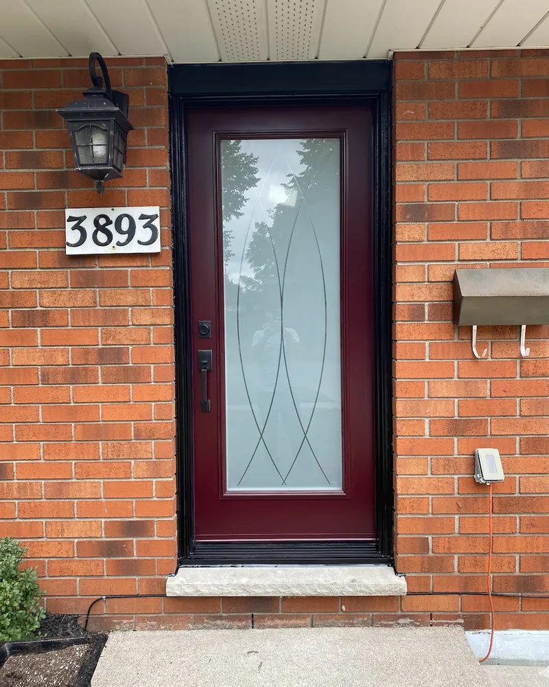 Front door on a red brick porch after replacement