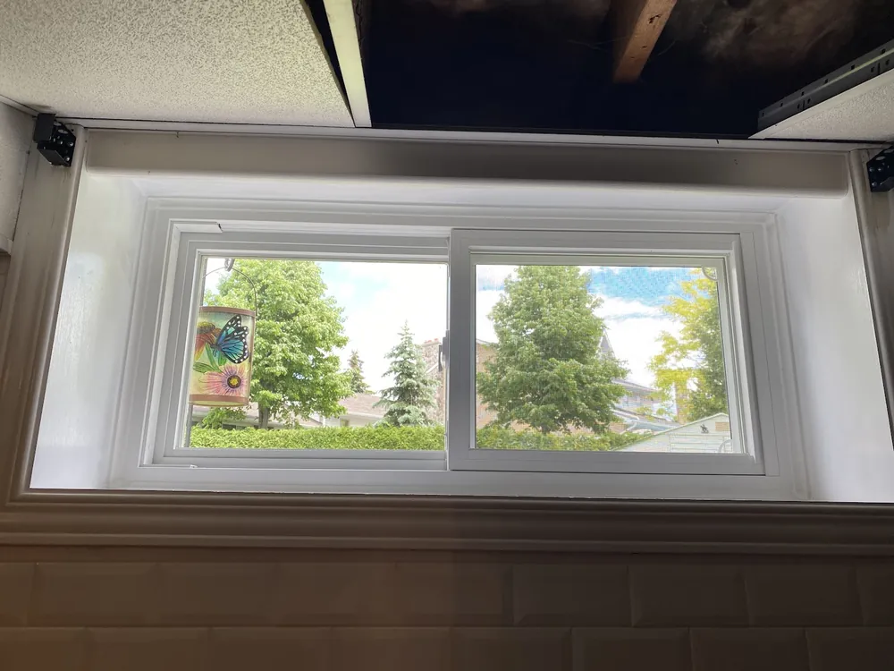 New basement slider window seen from inside in Oshawa, installed by Panorama Windows & Doors New basement slider window seen from inside in Oshawa