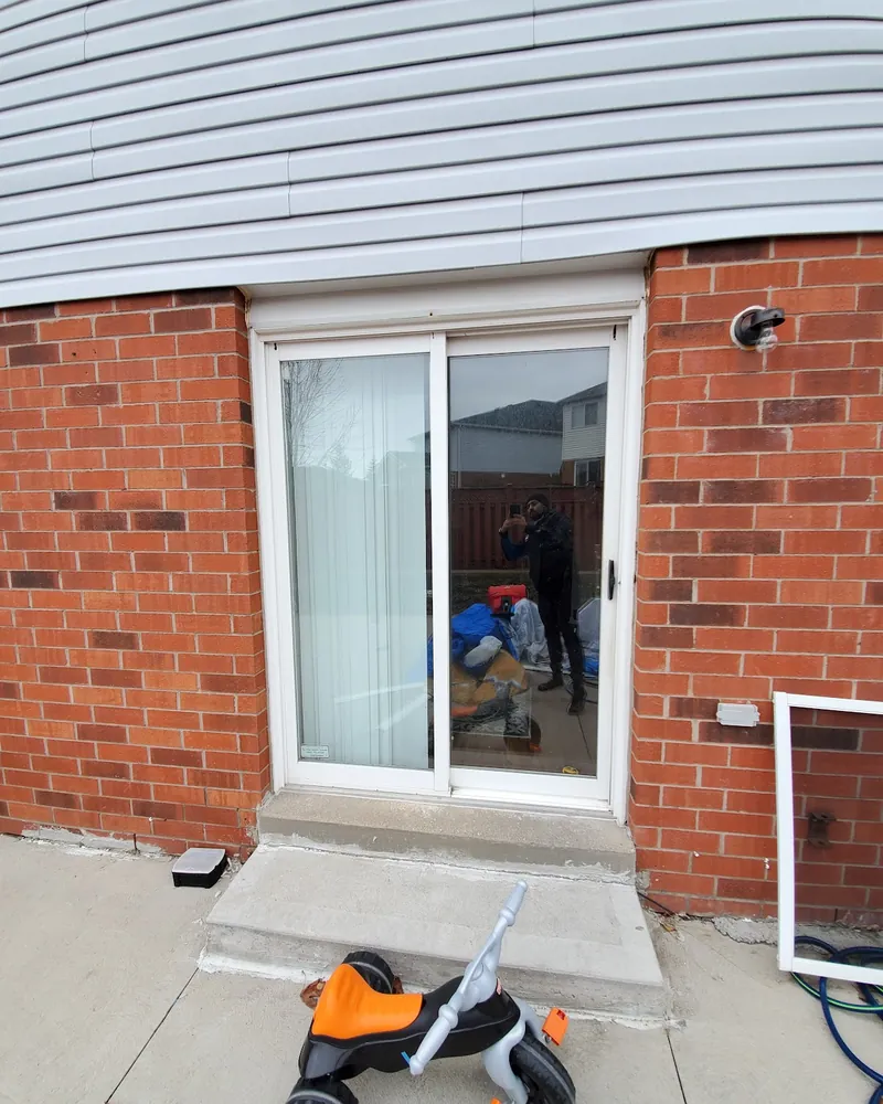 Sliding patio door at the back of a house before replacement