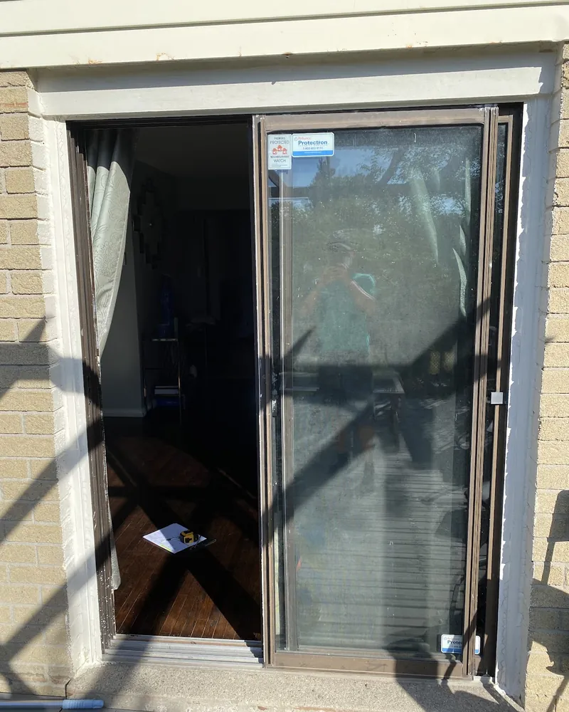 Sliding Door to White French Doors: before Rear patio door onto a deck before replacement