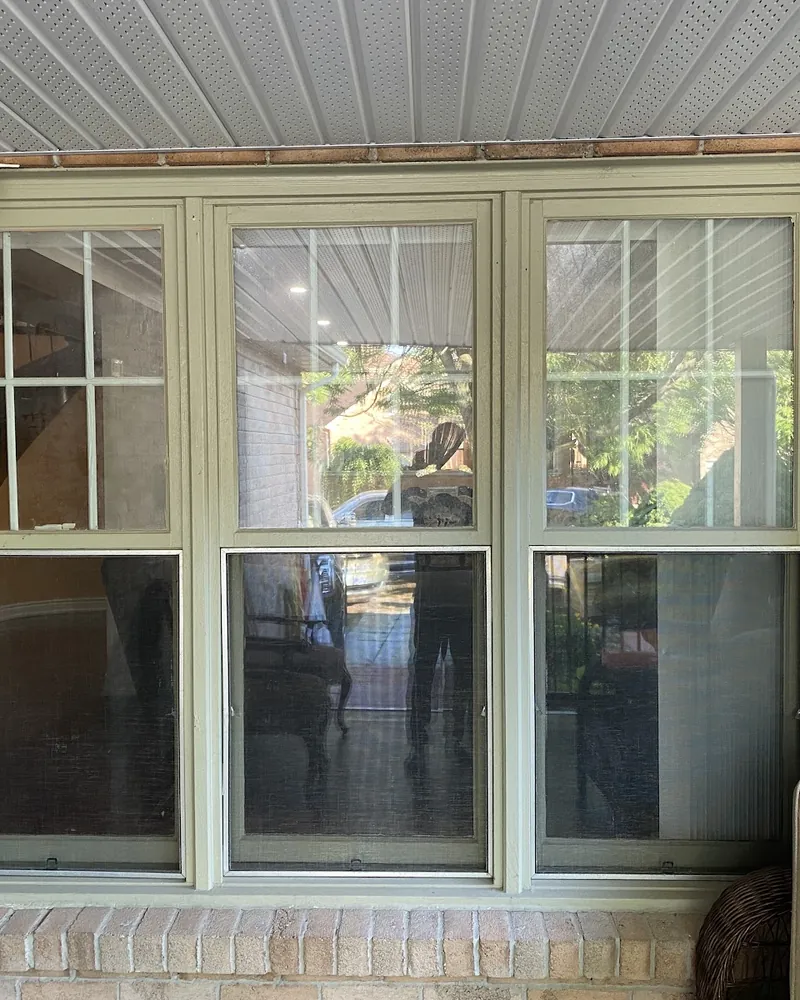 Porch Windows Replaced: before Three windows on a covered porch before replacement