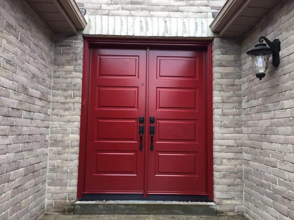 Red six-panel steel double doors