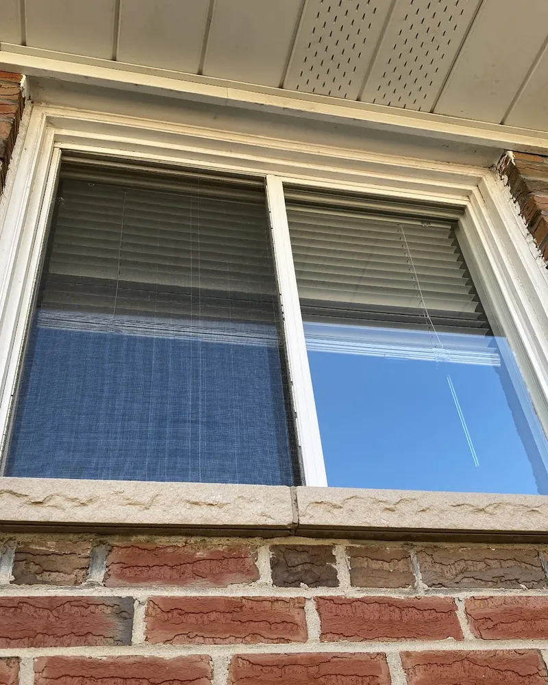 Slider Window to Casement Window: before Window on a brick wall before replacement