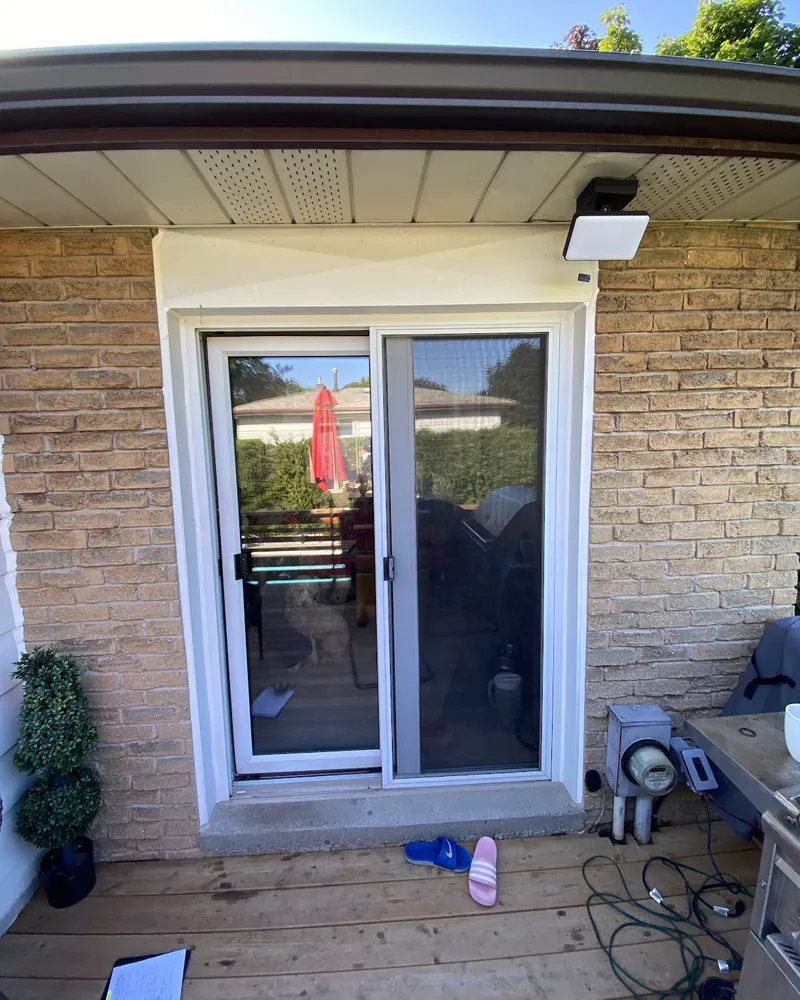 Sliding Patio Door on a Stone Wall: before Sliding patio door off a wood deck before replacement