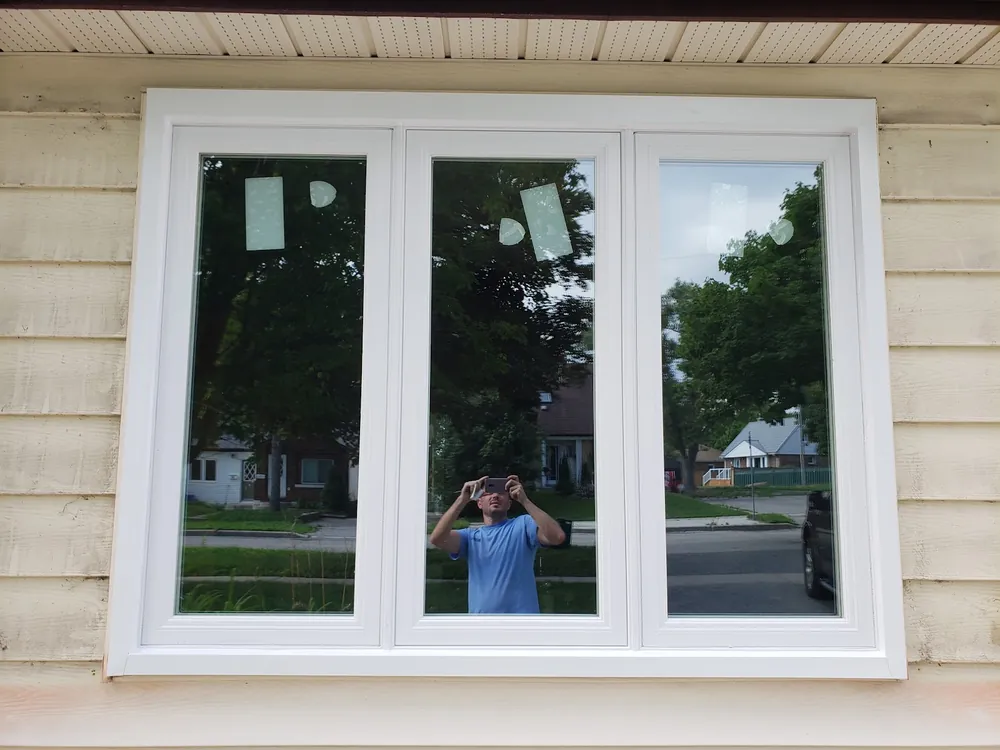 Triple casement window on siding, installed by Panorama Windows & Doors Triple casement window on siding