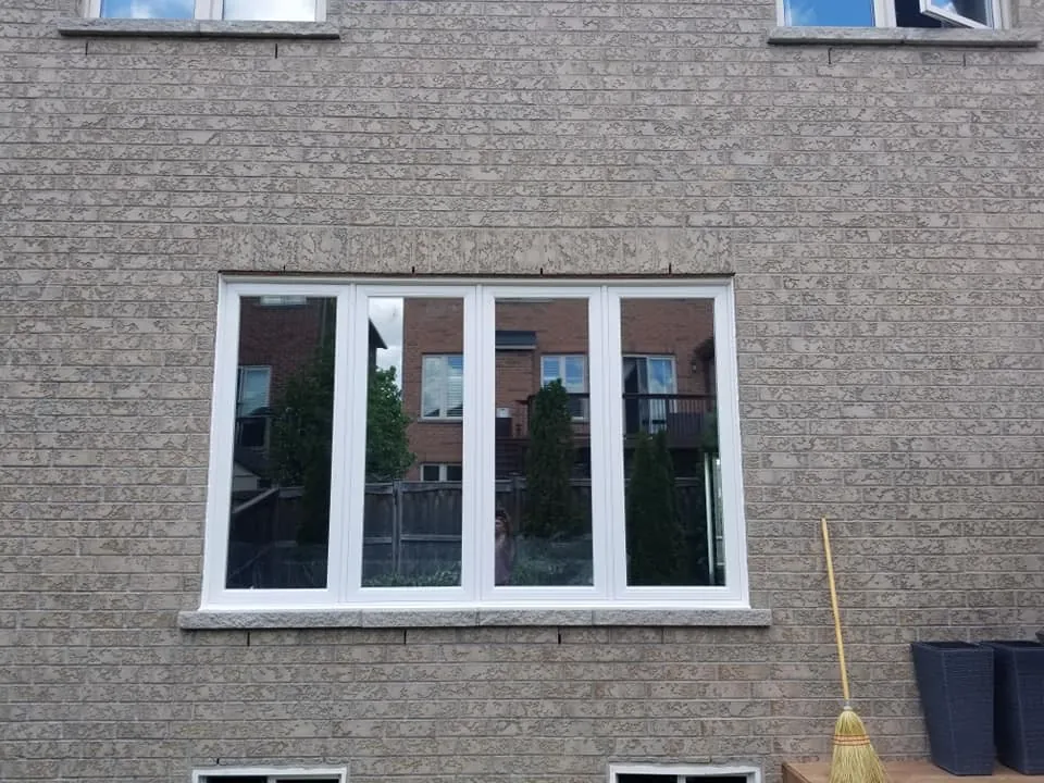 White vinyl four-lite casement window installed by Panorama Windows & Doors White vinyl four-lite casement window