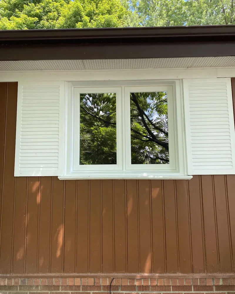 Window between white shutters after replacement